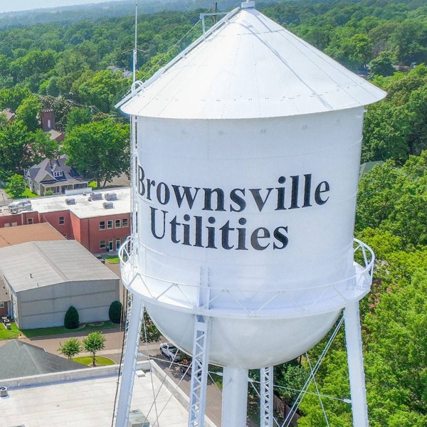 Drone view of white Brownsville Utilities tower