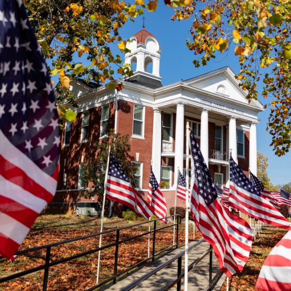 chester county courthouse with american flags lining sidewalk